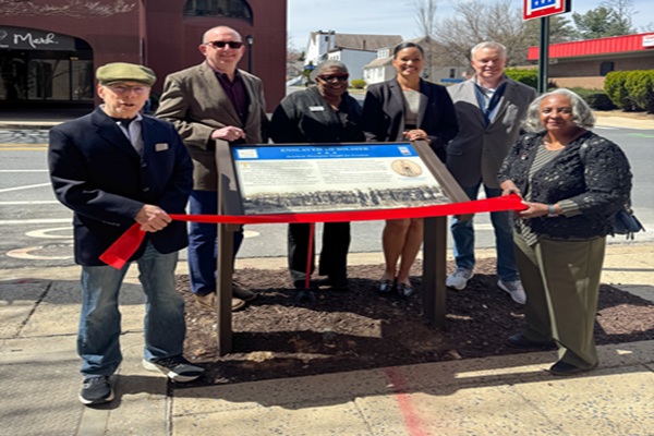 Group of people with Zedikiah Plaque